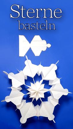 an origami snowflake with the words sterne basten on it