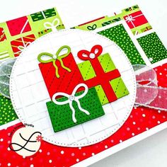 a close up of a christmas card with presents on it