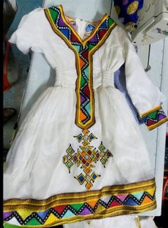 -Custom-made Ethiopian & Eritrean Dress. -This order takes approximately 4-5 weeks to make and deliver. -We will contact you about measurements instructions upon purchase. -You are allowed to change the colors and design. Fitted Multicolor Kaftan For Traditional Ceremonies, Traditional White Fitted Habesha Kemis, Traditional Fitted White Habesha Kemis, Traditional White Dress With Yoke Detail, Fitted White Habesha Kemis For Traditional Ceremonies, White Fitted Habesha Kemis For Traditional Ceremonies, Fitted Multicolor Kaftan With Traditional Patterns, White Folk Style Habesha Kemis, White Folk Habesha Kemis For Traditional Ceremonies