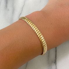 This finely handcrafted bracelet is completely composed of 14K solid gold and is finished with a lobster claw clasp . Total Length: available in your choice of 6.5 & 7 inches Bracelet Dimensions: approximately 5.8mm (W) x 2.35mm thick Weight: approximately 7 grams of 14K solid gold for the 7" option Metal Finish: High Shine Polish This design is available in 14K Yellow Gold Please note that this item takes about 3 to 5 business days for production, prior to shipping. This item is proudly finishe Yellow Gold Tarnish-resistant Snake Chain Bracelet, Yellow Gold Jubilee Bracelet With Snake Chain, Gold Plated Snake Chain Bracelet, Yellow Gold 14k Snake Chain Bracelet, Gold Flexible Snake Chain Bracelet, Yellow Gold Snake Chain Bracelet, Gold Snake Chain Bracelet With Adjustable Chain, Adjustable Yellow Gold Snake Chain Bracelet, Flexible Yellow Gold Snake Chain Bracelet