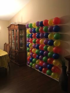 a dining room with balloons on the wall