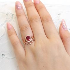 Vintage inspired ruby ring bridal set showcases a vintage halo ruby engagement ring with a curved leaf diamond wedding band as a unique stackable ruby ring set! This oval ruby and diamond bridal ring can be made in white, yellow, rose gold, or platinum. ** The hand model's ring size is US ring size 6.5 Rose Gold Wedding Set, Ruby Ring Set, Matching Ring Set, Rose Gold Bridal Set, Leaf Wedding Band, Vintage Halo, Ruby And Diamond Ring, Ruby Wedding, Red Eye