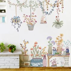 a wall with flowers and plants painted on it's sides, hanging from the ceiling