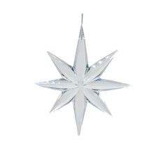 a white christmas ornament hanging from the ceiling with a star design on it