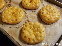 six pastries sitting on top of a baking sheet