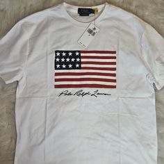 Brand New, Never Worn, With Tags, Polo By Ralph Lauren Graphic Tee Casual White Shirt With American Flag Print, White Cotton Shirt With American Flag Print, White Shirt With Flag Print For Spring, Casual White Tops With American Flag Print, White Casual Shirt With Flag Print, Casual White Shirt With Flag Print, White Cotton Top With American Flag Print, Casual Long Sleeve T-shirt With Flag Print, Spring White Shirt With Flag Print