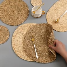 straw placemats and plates on a table