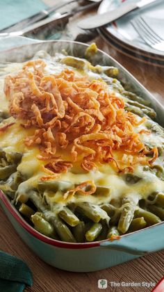 a casserole dish filled with green beans and cheese