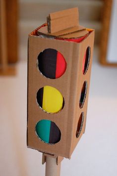 a cardboard traffic light sitting on top of a table