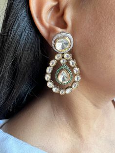 These gorgeous wedding Kundan earrings will add a perfect charm to your occasion wear. You will definitely fall in love with this beauty and it will make you stand out among the crowd. Weight 36 grams a pair Party Chandbali Chandelier Earrings With Elegant Design, Glamorous Wedding Earrings For Festive Occasions, Glamorous Wedding Earrings For Festive Season, Glamorous Festive Wedding Earrings, Elegant Silver Jeweled Danglers, White Dangle Chandbalis, Glamorous Hand Set Drop Earrings, Fusion Style Elegant Bridal Earrings For Celebration, Festive Glamorous Dangle Bridal Earrings