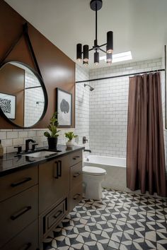 A modern brown bathroom design featuring black fixtures and white subway tiles, creating a sleek and stylish space. White Bathroom Inspiration, Black And White Bathroom, Bathroom Transformation, White Bathroom