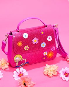 From Disney, this crossbody bag features Lizzie McGuire!
Featuring incredible detail to bring Lizzie McGuire to life, this Loungefly crossbody bag is made of vegan leather (polyurethane), long crossbody strap, and metal zipper enclosure. Lizzie Mcguire, Metal Zipper