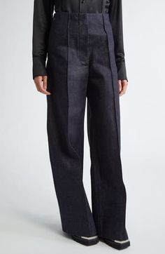 Seen on the designer's spring '24 runway, these nonstretch-denim, Hollywood-waist pants polished with pintucks are tailored in an oversized fit. 32 1/2" inseam; 25" leg opening; 13" front rise; 14 1/2" back rise (size small) Zip fly with hook-and-bar closure Side-seam pockets; back patch pockets 100% cotton Dry clean Made in the USA Designer Clothing Asian & Pacific Islander Owned/Founded Modern Denim Blue Wide-leg Pants, Designer Denim Bottoms With Pockets, Modern Wide-leg Denim Blue Pants, Modern Tailored Wide Leg Pants For Spring, Modern Denim Blue Pants For Fall, Chic Dark Wash Wide Leg Pants For Work, Elegant Dark Wash Pants For Workwear, Chic Dark Wash Pants For Work, Modern Dark Wash Wide-leg Pants