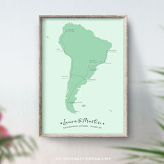 a framed map of the south and central america in pastel green on a white wall