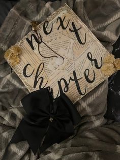 a graduation cap that has been decorated with black and white writing on top of it