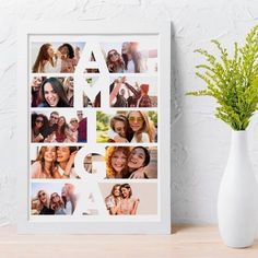 a white vase sitting next to a wall with pictures on it and a plant in the corner