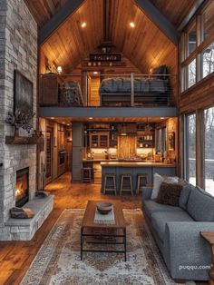 a living room filled with furniture and a fire place in the middle of a room