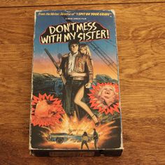 a vhs cover for the movie don't mess with my sister on a wooden table