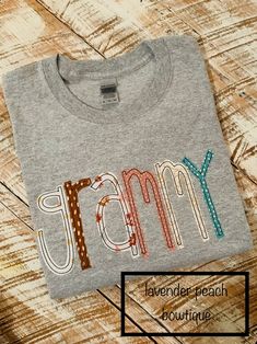 a gray t - shirt with the word jammy on it and polka dot trimmings