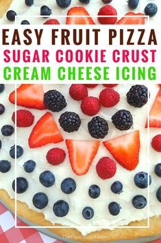 an easy fruit pizza with cream cheese icing and fresh berries on top is ready to be eaten