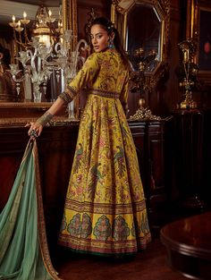 Editor's Note Featuring a hand painted and printed bageecha peacock floral motif on anarkali set adorned with thread embroidery. It is styled with a coordinated design border net dupatta. Fabric: Anarkali: viscose silk, dupatta: net Color: Yellow Components: Anarkali and dupatta Occasion: Wedding guest and festive Disclaimer: Product color may slightly vary due to photographic lighting sources or your monitor setting. Care: Dry Clean Only About the Designer Kalista is a luxury fashion label that Yellow Peacock, Yellow Anarkali, Anarkali With Dupatta, Green Anarkali, Traditional Attires, Green Peacock, Embroidered Anarkali, Sharara Set, Peacock Green