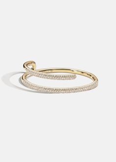 —The Crescendo Collection Crafted of solid 18K gold, the Mono Pavé Bracelet features bold lines that cascade around the wrist in new and unexpected directions. Approx 0.80tcw / 38.2 grams Diamond Grade: F/G color, VS clarity 2.25 " in length Available in Yellow Gold -Handmade in Los Angeles, California. Luxury Yellow Gold Open Band Bracelet, Luxury Open Band Bracelets For Formal Occasions, Luxury Open Band Bracelet For Formal Occasions, Yellow Gold Open Band Bracelets For Formal Occasions, Yellow Gold Open Band Bracelet For Formal Occasions, Formal Yellow Gold Open Band Bracelet, Formal Yellow Gold Bangle With Modern Twist, Modern 14k Gold Bracelet With Brilliant Cut, Gold Jewelry With Brilliant Cut In Modern Style