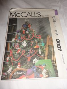 the front cover of mccall's christmas tree book, with decorations on it