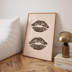 two framed pictures with leopard print on them