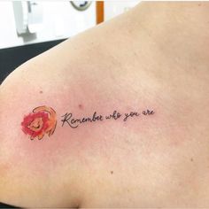 a woman with a tattoo on her shoulder that says, remember who you are