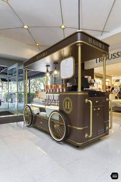 an ice cream cart in the middle of a shopping mall