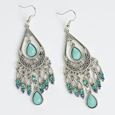 These Bohemian Style Tassel Earrings Feature Faux Turquoise Stones And Colorful Rhinestone Will Elevate Your Outfit With A Touch Of Boho Flair. Designed For Those Who Appreciate Unique And Feminine Accessories, These Long Fringe Dangle Earrings Exude An Effortlessly Stylish Charm. The Delicate Tassels Dance With Every Movement, Adding A Playful And Eye-Catching Element To Your Look. The Earrings Measure Approximately 3 Inches From Top Of Ear Hook To Bottom Of Earring. Nwot, Never Been Worn. Bund Blue Bohemian Crystal Earrings, Bohemian Blue Crystal Earrings, Blue Bohemian Crystal Drop Earrings, Bohemian Blue Crystal Drop Earrings, Blue Teardrop Bohemian Crystal Earrings, Silver Bohemian Teardrop Earrings For Party, Feminine Accessories, Long Fringe, Long Fringes