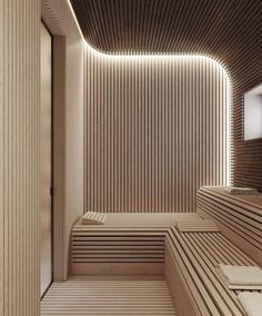 an empty sauna with wooden slats and lights on the ceiling is seen in this image