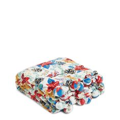 the multicolored floral print blanket is folded on top of each other, and it has