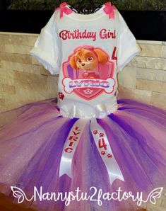 a birthday girl paw patrol shirt and purple tutu skirt set with matching headband