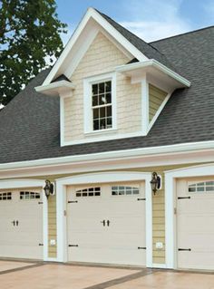 two story garage with three windows on each side