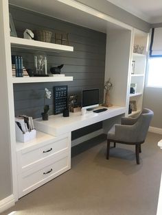 a home office area with desk, chair and bookshelf