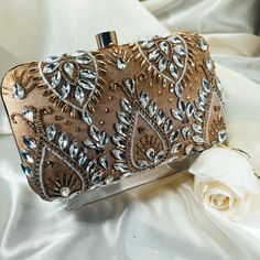 If a show-stopper is what you're in the market for, this crystal-studded evening clutch will add a serious kick to your wardrobe!   Size: 8×4 inches Shoulder strap included. Glamorous Rhinestone Party Clutch, Rectangular Evening Clutch With Sequins, Rectangular Sequin Clutch For Evening, Glamorous Clutch With Rhinestones For Night Out, Chic Embellished Clutch For Party, Glamorous Embellished Evening Bag, Glamorous Party Clutch With Bling, Embellished Evening Clutch Bag, Embellished Evening Bag For Party Season