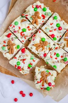 a piece of white chocolate barkle with christmas candy and candies on the side