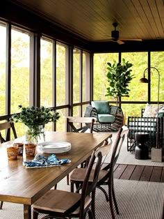 a wooden table sitting on top of a covered porch