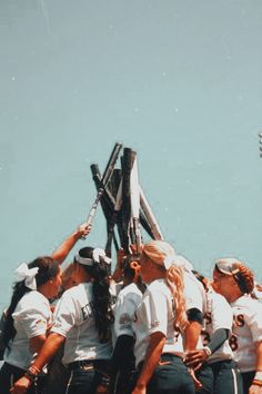 a group of people sitting on top of each other in the middle of a boat