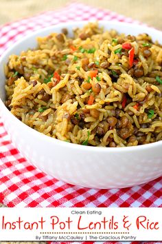 instant pot lentils and rice in a white bowl on a red checkered tablecloth