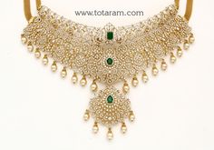 18 karat gold 'detachable / 5 in 1' diamond choker necklace with color stones & south sea pearls
  this product has inter changeable stones in the necklace and pendant.
  this product has a detachable pendant which can be used as a separate pendant with most chains.
  length of the pendant : 2.65 inches
  width of the pendant : 1.65 inches


introducing our exquisite 18 karat gold 'detachable / 5 in 1' diamond choker necklace, a true masterpiece crafted in india by totaram jewelers. this stunnin Luxury Necklace With Detachable Pendant For Celebration, Luxury Festive Choker Temple Necklace, Luxury Temple Jewelry With Detachable Pendant, Detachable Pendant, Diamond Choker Necklace, Diamond Choker, Color Stones, South Seas, South Sea Pearls