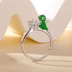 Daspletosaurus, also known as Tyrannosaurus, is a genus of dinosaurs under the family Tyrannosaurus that lived in western North America during the Upper Cretaceous period, 77 million to 74 million years ago. This Jeulia Hug Me® ring is made of sterling silver, vividly presenting the cute posture of a cartoon daspletosaurus. It will be perfect gift for dinosaur lovers or just add an special addition to your jewel collection. You will find more adorable and creative designs in our Hug Me® collecti Me Cartoon, Dinosaur Jewelry, Cretaceous Period, Cartoon Dinosaur, Hug Me, Buy One Get One, A Cartoon, Creative Designs, Dinosaurs