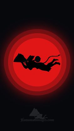 the silhouette of a person diving in front of a red circle