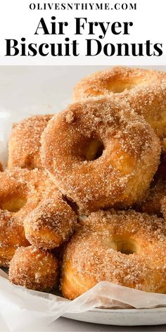 a pile of air fryer biscuit donuts on a white plate with text overlay