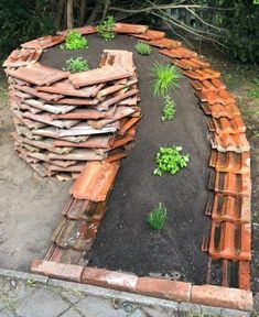 a circular garden bed made out of bricks