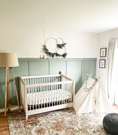 a baby's room with a crib and rug