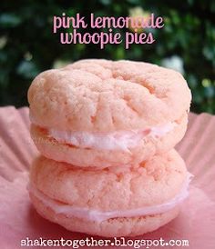 three pink lemonade whoopie pies stacked on top of each other