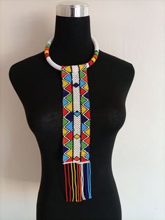 African wedding necklace, Zulu necklace, Beaded shawl necklace, African jewelry, Masai necklace, Bridesmaid necklace, Wedding gift This stunning necklace is superbly crafted with fine beads. The necklace can be worn with any outfit at different occasions and it will absolutely make you stand out. 100% handmade using fine beads. Closure: hooks. Color: White. 3-5 days delivery via DHL Express The shipping fee is for the first item only and additional necklaces or items ship for free. Wholesale ava Bridal Necklace With Colorful Round Beads In White, White Unique Long Beaded Necklace, White Bridal Necklace With Colorful Round Beads, Unique White Long Beaded Necklace, White Bridal Necklace With Colorful Beads As Gift, Traditional White Necklace With Colorful Beads, White Beaded Long Bridal Necklace, Traditional White Necklace With Tiny Beads, Traditional White Choker With Round Beads