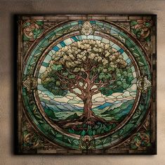 a stained glass window with a tree in the center